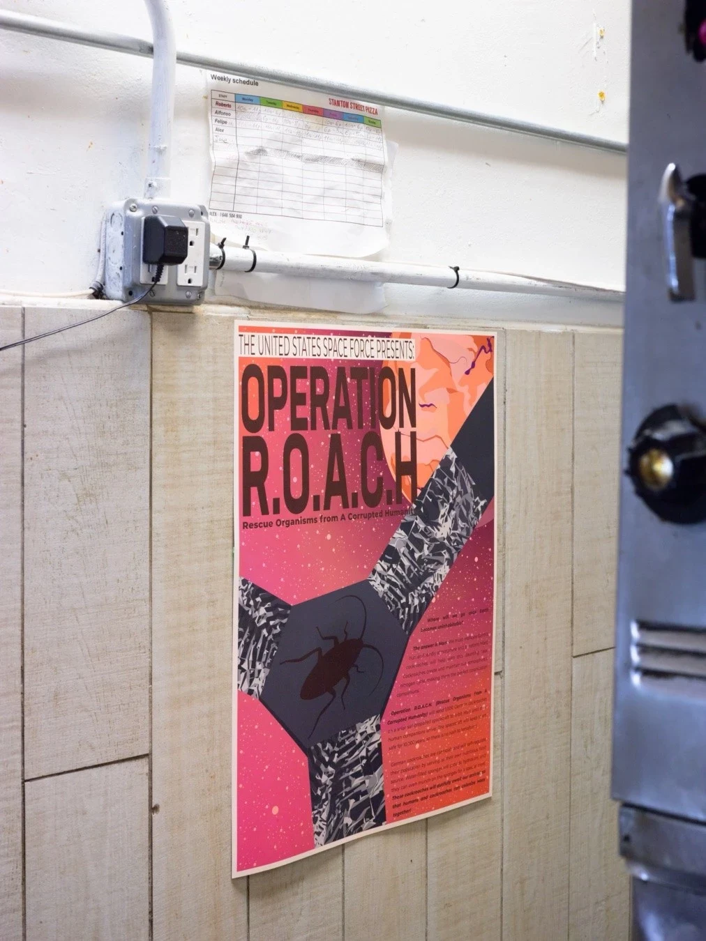 An exhibition poster on a metal door.