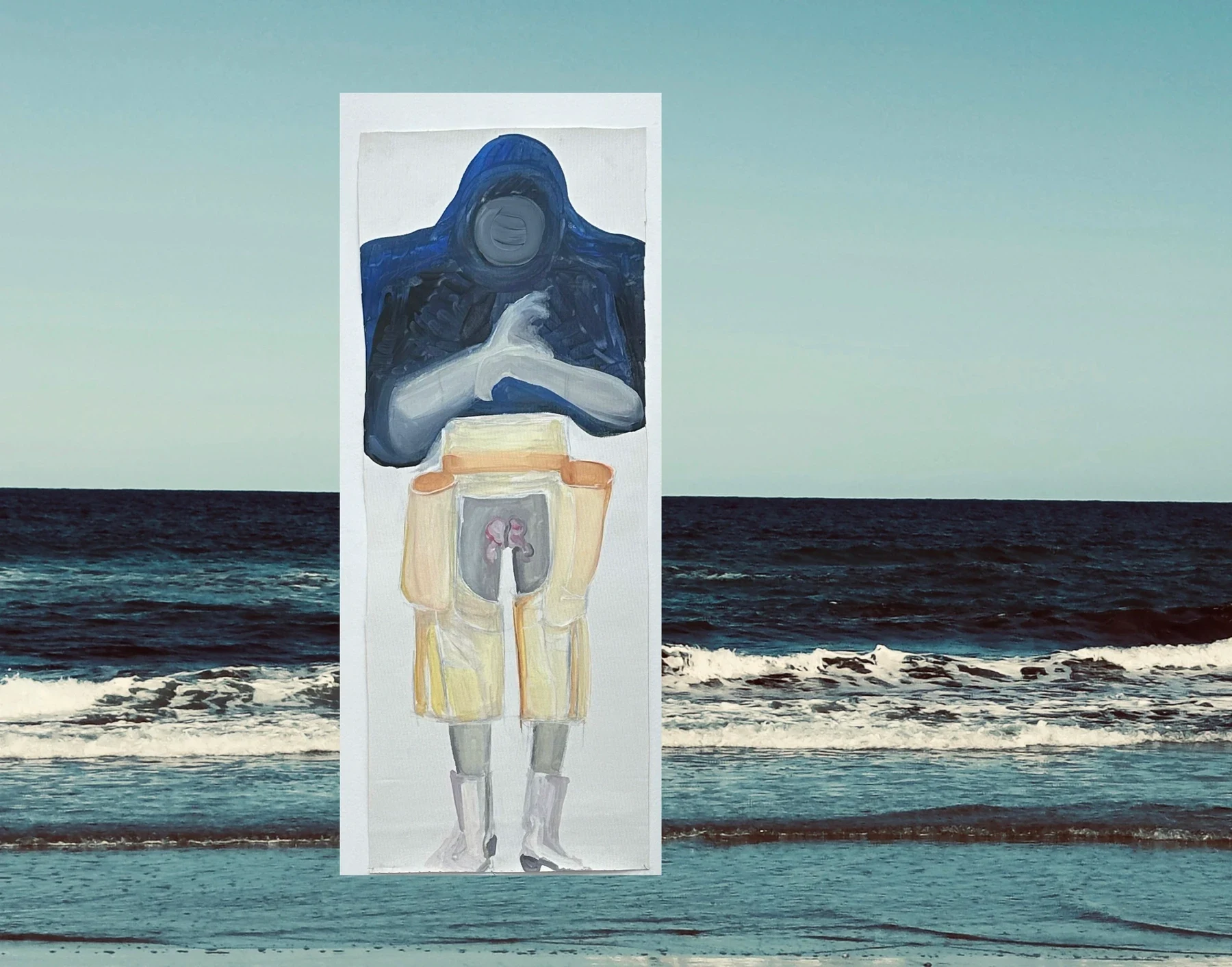 A blue and yellow painted figure on a white panel at the shoreline.
