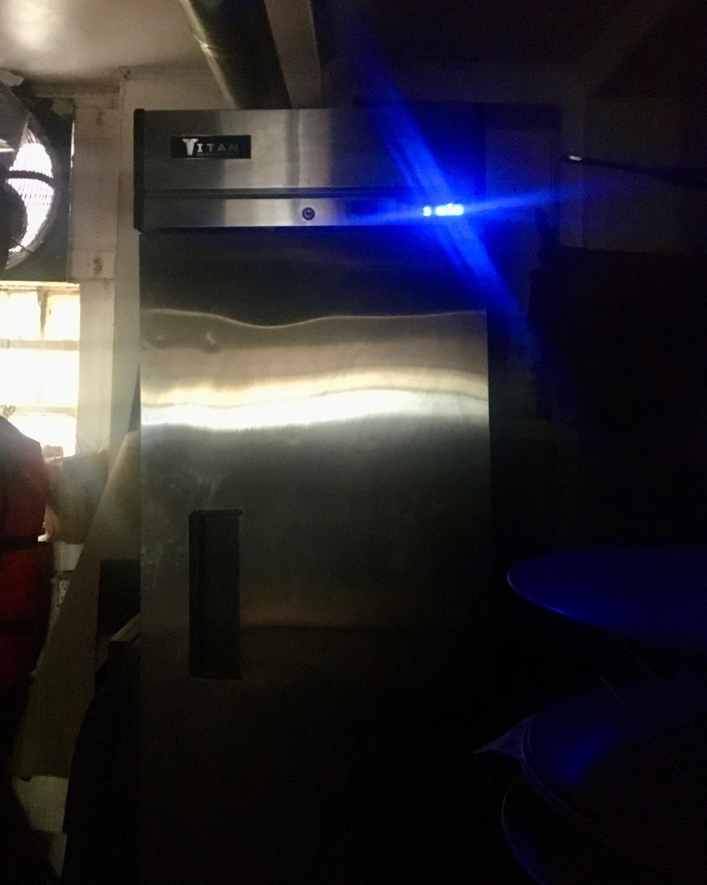 A bright beam of projected light in a dark room.