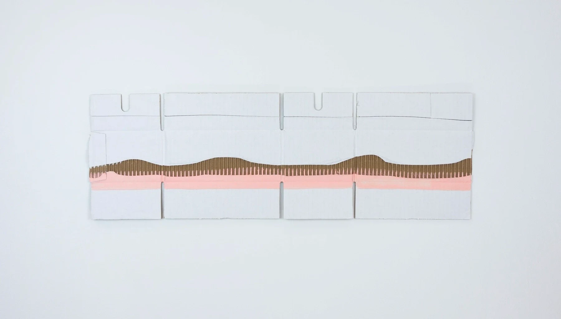 A white unfolded box with a narrow pink and brown painted band.